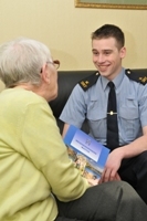 A Community Guard talks to a resident about the Neighbourhood Watch Scheme